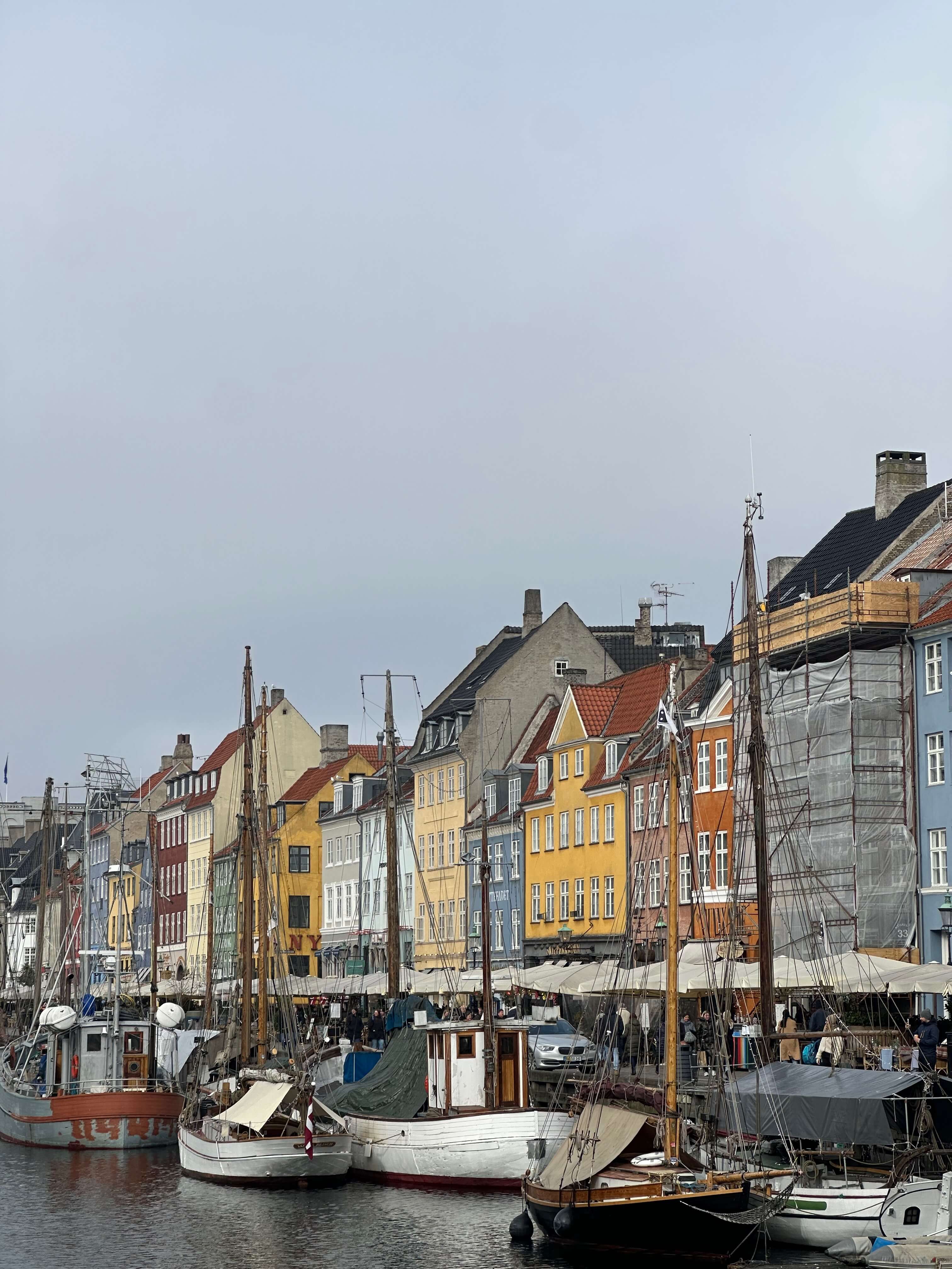 Colorful buildings and boats along Nyhavn in Copenhagen