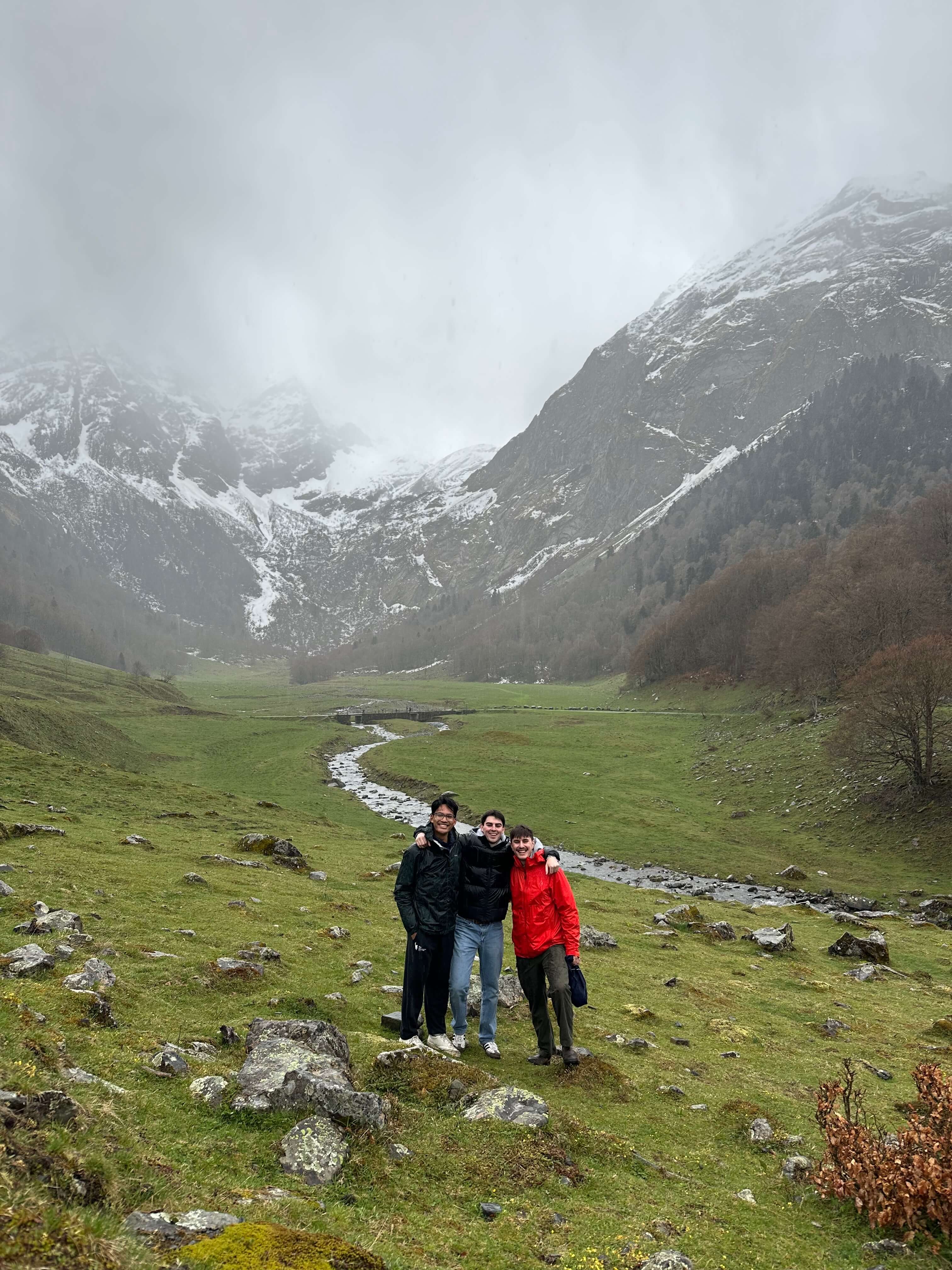 Hiking in the Pyrenees with snow-covered peaks in the background